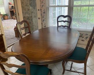 Dining table 4 chairs and extra leaves $350