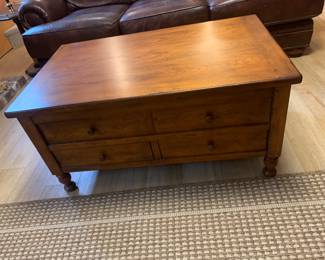 Coffee table with sliding top…inside storage and instant eating spot while tv viewing. 