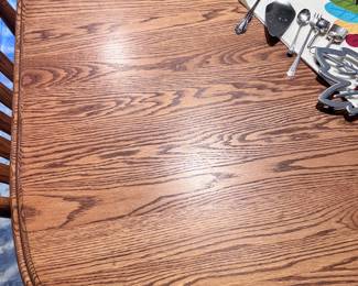 BEAUTIFUL SOLID OAK DOUBLE PEDESTAL BASE DINING ROOM TABLE AND 8 CHAIRS -  HAS 4 LEAFS EACH 12' WIDE. WHEN 4 ARE IN THIS TABLE IS APPROX 113 INCHES!! SO USE IT AS A SMALL OVAL OR EXTEND FOR LARGE GATHERINGS. GREAT SHAPE!