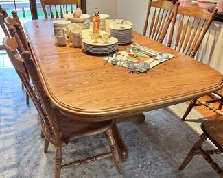 BEAUTIFUL SOLID OAK DOUBLE PEDESTAL BASE DINING ROOM TABLE AND 8 CHAIRS -  HAS 4 LEAFS EACH 12' WIDE. WHEN 4 ARE IN THIS TABLE IS APPROX 113 INCHES!! SO USE IT AS A SMALL OVAL OR EXTEND FOR LARGE GATHERINGS. GREAT SHAPE!