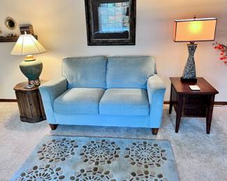 Living room furniture including matching light blue loveseat and sofa