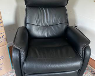Reclining vegan leather chair.