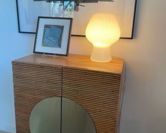 Decorative lamp and bar cabinet from CB2.