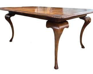 Gorgeous Baker inlaid dining table with exaggerated cabriole legs and pad feet
