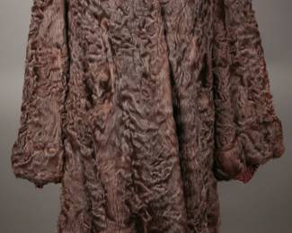 Lovely Early 1940s cognac colored broadtail lamp overcoat with bell sleeves and vamp collar