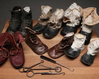 Large lot of turn of the century leather baby shoes and boots with button hooks