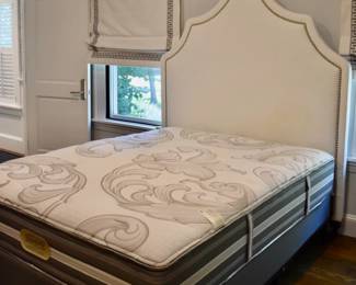 Queen bed with upholstered headboard