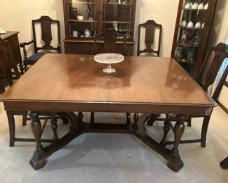1930's walnut dining table w 6 chairs and 3 leaves, top extends to 8' with the 3 leaves in