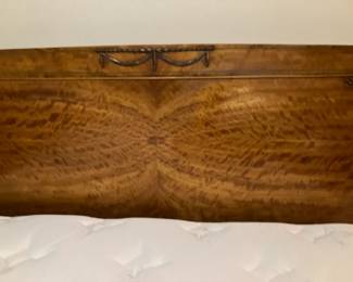 Closeup of the burled wood on the headboard