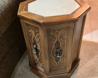 One of a pair of marble-top hexagon shaped end tables