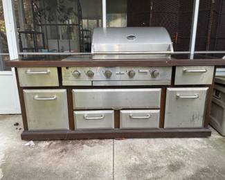 7 feet wide, which is equivalent to 84 inches, 26 inches depth and 36 inches tall in the center where the grill is is 48 inches tall