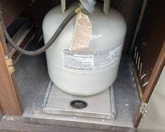 7 feet wide, which is equivalent to 84 inches, 26 inches depth and 36 inches tall in the center where the grill is is 48 inches tall