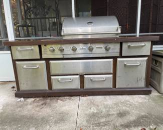 7 feet wide, which is equivalent to 84 inches, 26 inches depth and 36 inches tall in the center where the grill is is 48 inches tall
