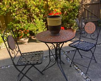 clay pottery and black iron cafe table and 2 chairs $50.