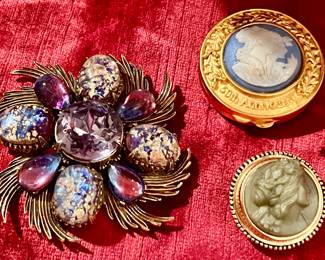 Ester launder compacts. Brooches. Lots of perfume