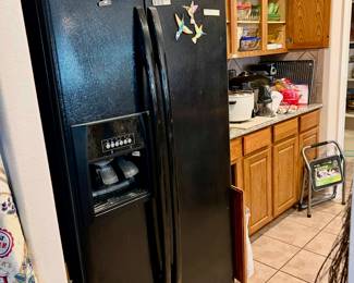 WHIRLPOOL BLACK SIDE BY SIDE REFRIGERATOR.