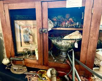 ANTIQUE OAK CABINET FULL OF GOODIES.  ANTIQUE GAS IRONS