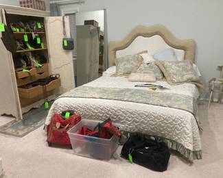Beautiful bed and tons of purses!