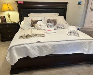 King size adjustable mattress with boxspring and king-size bedroom suit with dresser, chest, two nightstands and king-size headboard, footboard, and base