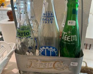 Vintage soda, bottles, and Pepsi antique bottle carrier