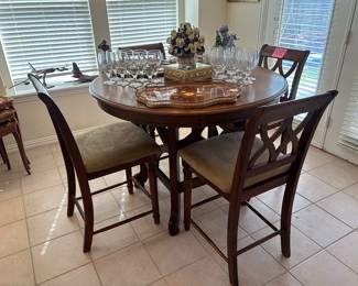Very nice bar, height, dining table, and four chairs