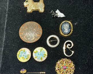Cameo, sterling silver and costume brooches