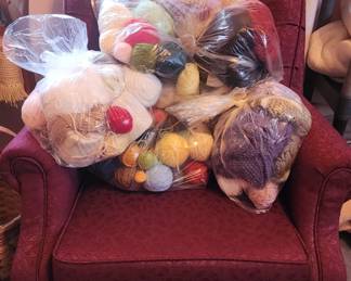 Lots of yarn, maroon armchair