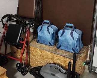 Drive walker, shop vac, his and hers bowling balls, nice vinyl folding table and chairs