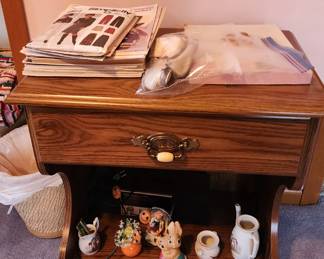 Nightstand with sewing books and tchotchkies