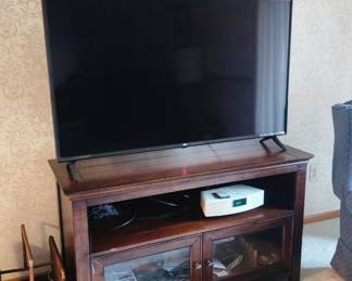 LG 55 in HDTV, beautiful wood TV stand, DVD, VCR, Bose Wave system, magazine rack, DVD's/CD's, more