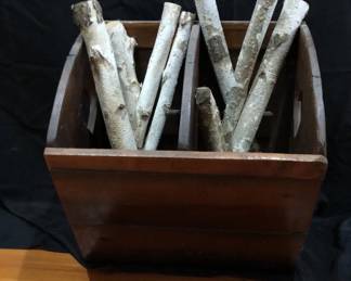 Decorative Wooden Log Holder filled with white birch logs. 
