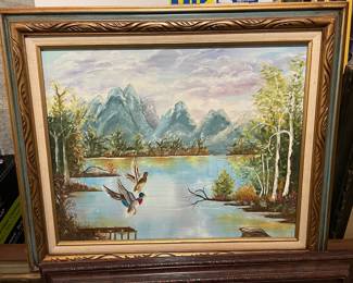 Framed Painting of Flying Ducks over a River Landscape
