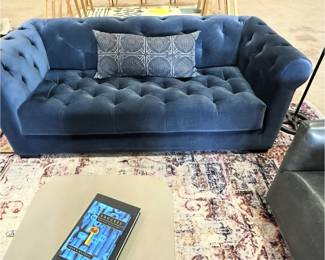 tufted blue low back sofa