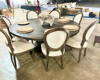 gorgeous round dining table and upholstered chairs