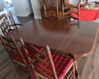 Ethan Allen Dining room table with 8 chairs. It has two leaves (18") and pads. The table is 66" x 42".