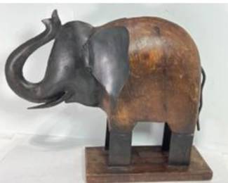 Heavy wood and metal elephant sculpture. 