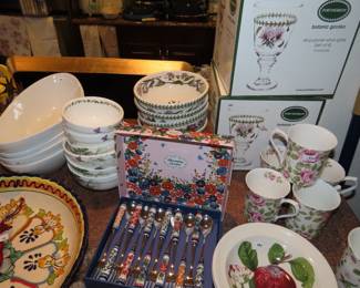 Port Meirion boxed stemware, dishes and bowls. Queens bone china mugs, boxed dessert spoon and fork set.