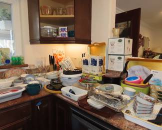 Asian dinnerware, strainers, knives, flatware sets, measuring jugs, salad spinner, mixing bowls.