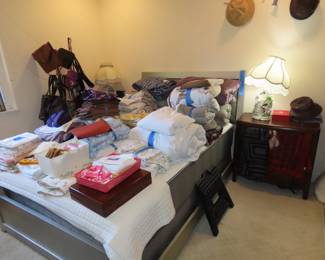 Bed linens of all sizes, nightstands, table lamps, purses, blankets, comforters and pillows.