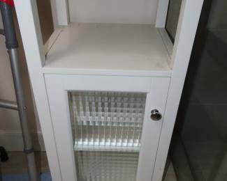 White free standing bathroom cabinet.