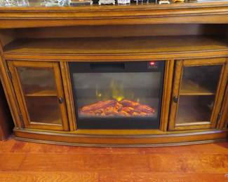 TV media stand with built in electric fire place with remote.