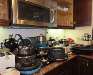 Cookware, electric grill, electric skillet, multiple rice cookers, toaster, coffee maker, baking trays., glass blender, food chopper.