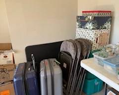 Folding table with 4 chairs and luggage