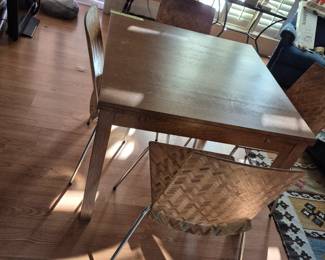 Table with four woven chairs