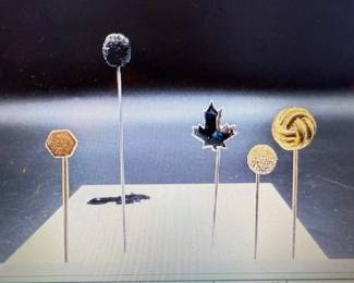 Hat pins. https://modestlambestatesales.hibid.com/