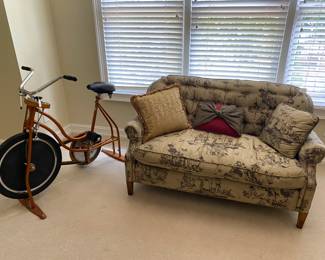 Vintage exercise bike with silk settee