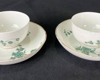 Pair of Early Chelsea Porcelain Handleless Cups and Saucers