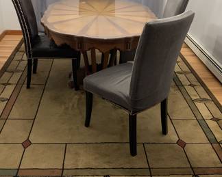 Exquisite dining table with two leaves. Chairs are slip covered and do not match the table. All being sold separately. Area rug is also available.