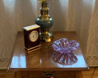 Oak veneered end table with drawer. We have two matching lamps (one on nightstand in bedroom picture)