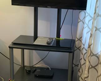 Samsung flatscreen television and stand complete with remote and instructions